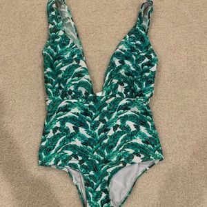 Tropical one piece swimsuit with high waist sides